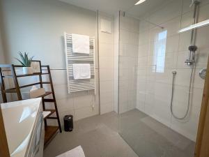Koupelna v ubytování "THREE" - Premium Apartments Seekirchen, modern, zentral gelegen