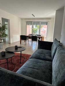 a living room with a couch and a table at Residenza Arazzo in Minusio
