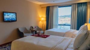 Postel nebo postele na pokoji v ubytování فندق الصفوة البرج الأول Al Safwah Hotel First Tower 1 + 37 fotografií