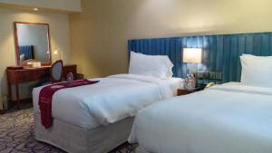 Postel nebo postele na pokoji v ubytování فندق الصفوة البرج الأول Al Safwah Hotel First Tower 1