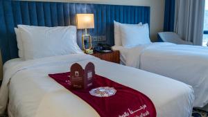 Postel nebo postele na pokoji v ubytování فندق الصفوة البرج الأول Al Safwah Hotel First Tower 1
