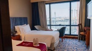 Postel nebo postele na pokoji v ubytování فندق الصفوة البرج الأول Al Safwah Hotel First Tower 1