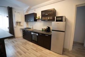Dapur atau dapur kecil di Alex 4 Apartment