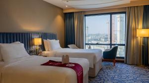 Postel nebo postele na pokoji v ubytování فندق الصفوة البرج الأول Al Safwah Hotel First Tower 1