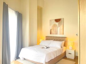 a bedroom with a bed and a window at Opulent Spacious 3 BR Condominium at St Dominique at Megaworld in Iloilo City +47 photos