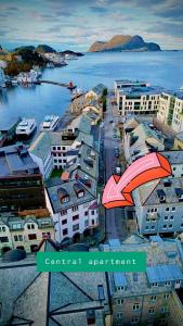 an aerial view of a city next to the water at Central apartment in Ålesund +11 photos