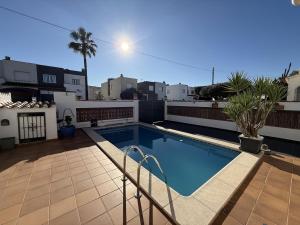 a swimming pool on the roof of a house at AwayDays - Casa con Piscina in Empuriabrava