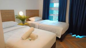 BIG TREE HOTEL客房内的一张或多张床位