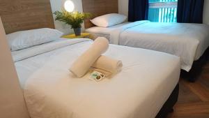 BIG TREE HOTEL客房内的一张或多张床位