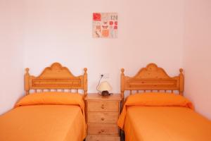 Säng eller sängar i ett rum på Casa Maremar