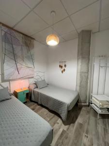 A bed or beds in a room at Alojamientos Rurales Cuatro Estaciones
