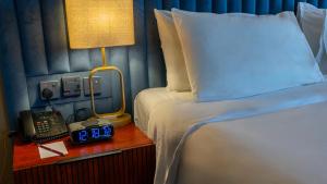 Postel nebo postele na pokoji v ubytování فندق الصفوة البرج الأول Al Safwah Hotel First Tower 1