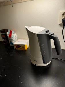 a coffee maker sitting on top of a counter at Centrum Box in Oslo