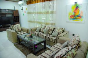 a living room with couches and a coffee table at Nima villa in Tangalle