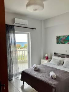 Ένα ή περισσότερα κρεβάτια σε δωμάτιο στο Seasmiles2