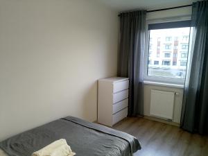 Ένα ή περισσότερα κρεβάτια σε δωμάτιο στο Apartament 22