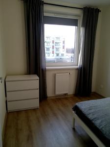 Ένα ή περισσότερα κρεβάτια σε δωμάτιο στο Apartament 22 +10 φωτογραφίες