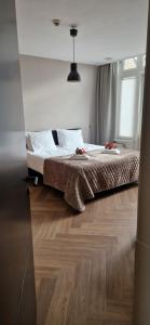 Postel nebo postele na pokoji v ubytování Apart Hotel De Grote Kade