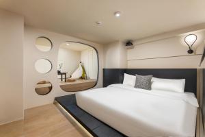 Postel nebo postele na pokoji v ubytování GTOOO Hotel