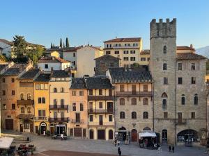 a group of buildings in a city with a tower at Via Roma 25 Bed&Breakfast in Arezzo
