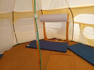 a pole in a tent with a treadmill in it at Tamar Land in Kalia