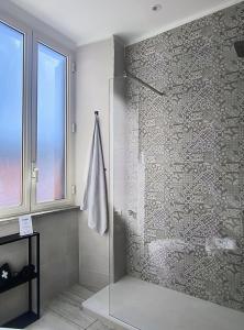 a bathroom with a shower with a glass wall at Majestic Salus Spa in Fiuggi +24 photos