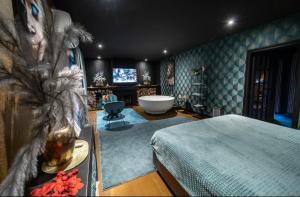 Ένα ή περισσότερα κρεβάτια σε δωμάτιο στο De luxe Bed &Wellness