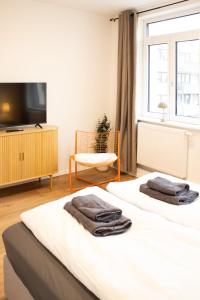 Postel nebo postele na pokoji v ubytování Urbanes Messe Apartment