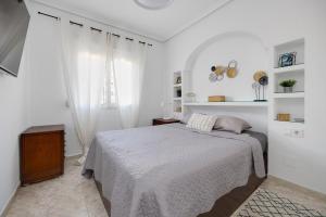 Łóżko lub łóżka w pokoju w obiekcie CB Living - Cozy condo with patio, Playa Flamenca