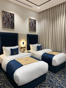Postel nebo postele na pokoji v ubytování فندق تارا بلس Tara Plus Hotel