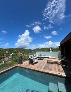 a house with a swimming pool and a patio at Villa Leo St jean St Barthelemy in Saint Barthelemy