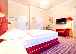 Postel nebo postele na pokoji v ubytování Aviano Boutique Hotel