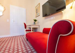 TV a/nebo společenská místnost v ubytování Aviano Boutique Hotel