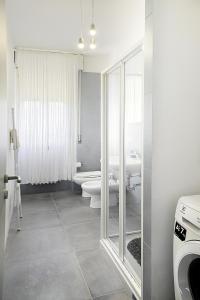 a bathroom with a toilet and a sink at [LIDO DI FERMO-FREE PARKING] Appartamento miramare in Lido di Fermo +24 photos