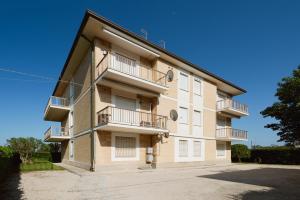 an apartment building with balconies on the side at [LIDO DI FERMO-FREE PARKING] Appartamento miramare in Lido di Fermo