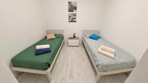 Postel nebo postele na pokoji v ubytování Il Gatto e La Volpe Foresteria Lombarda