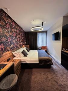 Postel nebo postele na pokoji v ubytování Calma Luxury Rooms
