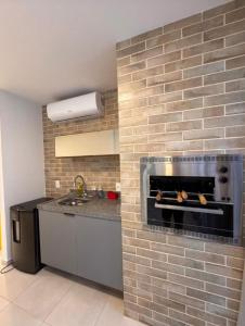 Η κουζίνα ή μικρή κουζίνα στο Apartamento no Frances alto padrão +28 φωτογραφίες