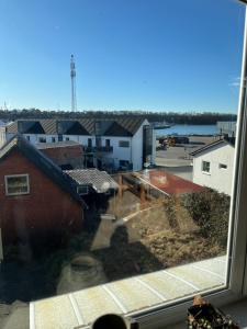 a view of a city from a window at Holiday Home Penthouse Lemvig in Lemvig