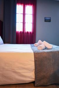 Postel nebo postele na pokoji v ubytování Hôtel du vieux pont