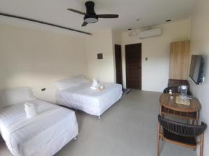 Ένα ή περισσότερα κρεβάτια σε δωμάτιο στο Orchrd Lodge