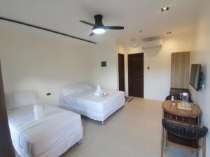 Ένα ή περισσότερα κρεβάτια σε δωμάτιο στο Orchrd Lodge