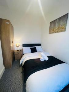 a bedroom with a large bed in a room at Large 'n' bright House in Middlesbrough