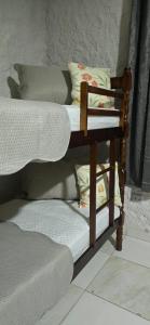 Postel nebo postele na pokoji v ubytování Suítes Maresia