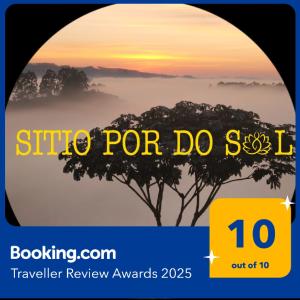 a picture of a foggy sunrise with a tree in the background at Sítio por do Sol - Pedra Azul - ES in Pedra Azul