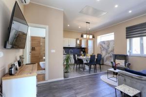 a living room and dining room with a couch and a table at Casa Lorela in Sali
