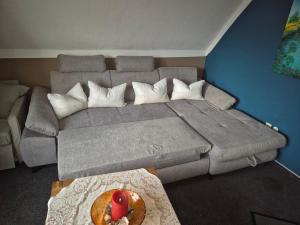 a living room with a couch and a table at Hühnerhof-Röhrs in Schneverdingen
