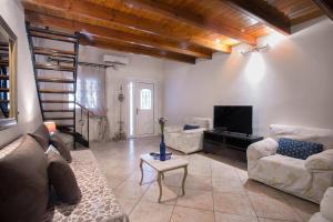 Posezení v ubytování Aris Cosy Casa + 10 fotografií