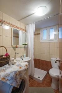 Koupelna v ubytování Aris Cosy Casa