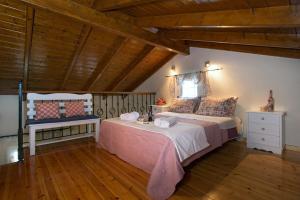 Postel nebo postele na pokoji v ubytování Aris Cosy Casa